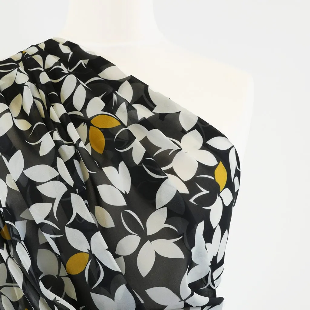 Ice Chiffon 4848 - Lime on Black Odd Petals Woven Fabric from John Kaldor Sample